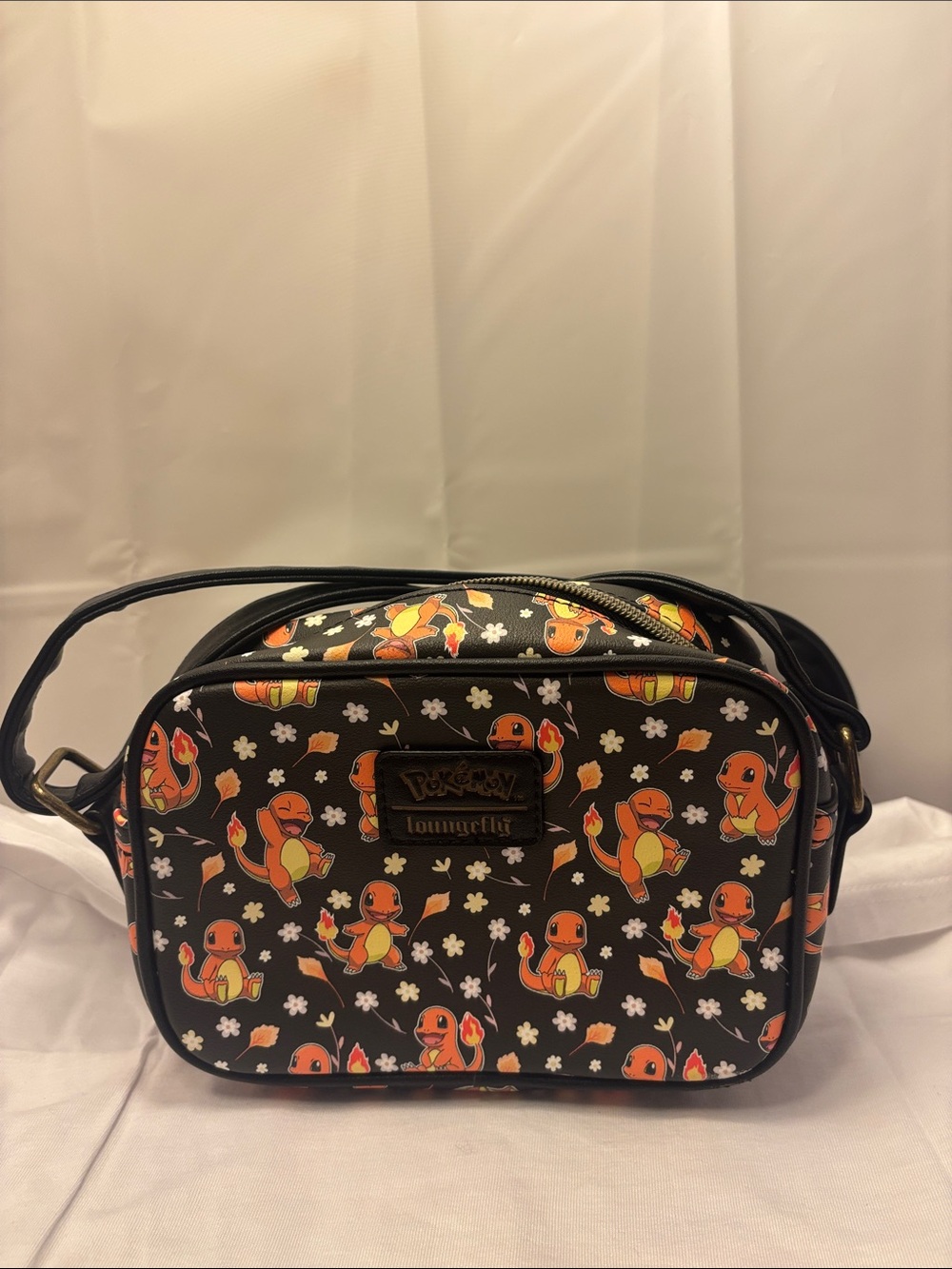 POKEMON LOUNGEFLY Black Crossbody Bag with Orange Charmander Print